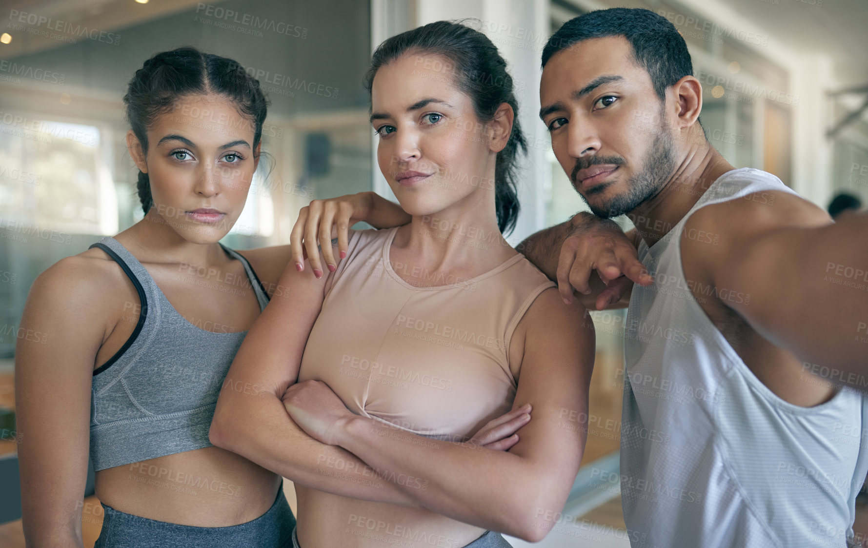 Buy stock photo Cropped portrait of three young athletes standing together in the gym
