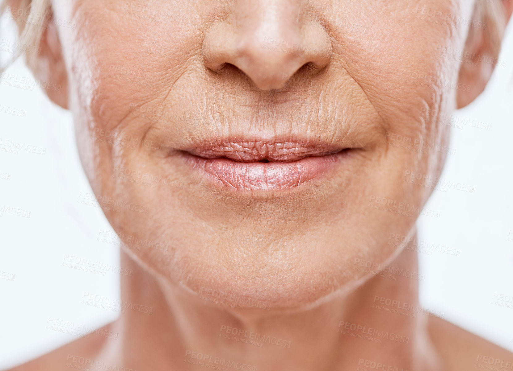 Buy stock photo Cropped shot of a mature woman's mouth