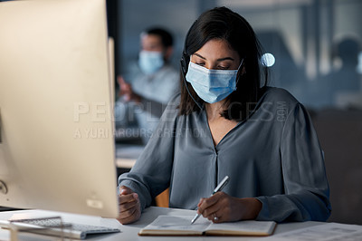 Buy stock photo Call center, woman and notes at computer with mask for customer service, sales consulting and CRM in office. Female agent, consultant and virus protection in telemarketing agency for administration