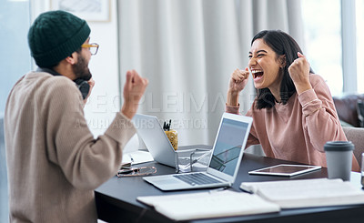 Buy stock photo Shot of a young couple having an argument while working from home