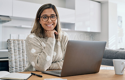 Buy stock photo Cropped shot of a woman using her laptop while working from home
