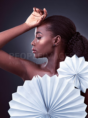 Buy stock photo Black woman, profile and origami fans in studio, cosmetics and oriental beauty on dark background. Female person, skin treatment and confidence for glow, serious and foundation shine for dermatology
