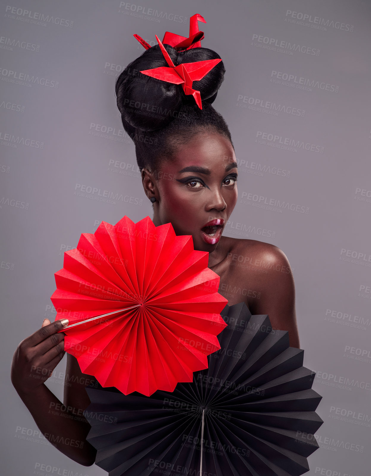 Buy stock photo Shocked, makeup and beauty with portrait of black woman in studio for creative, art and culture. Traditional, cosmetics and paper design with model on grey background for fashion, origami or color