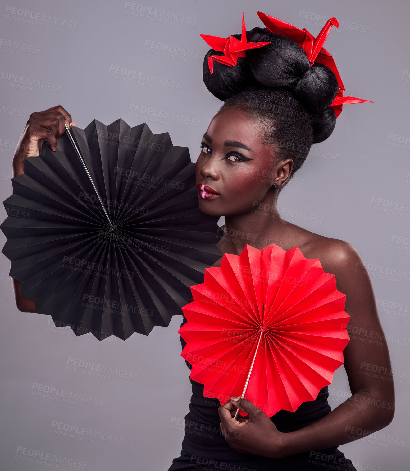 Buy stock photo Black woman, fashion and studio for African portrait, oriental paper art and origami with fan or cosmetic beauty. Makeup, swan inspiration and trendy with cosmetology, culture or tradition with pride