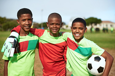 Buy stock photo Portrait of a group of young boys playing soccer on a sports field