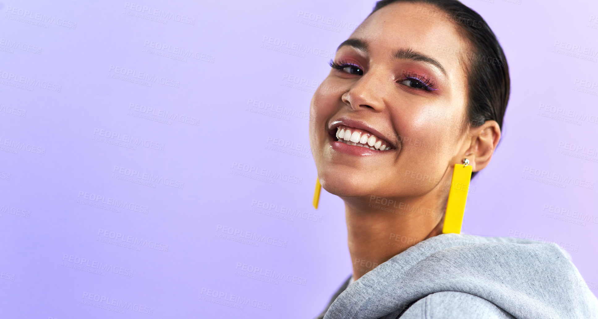 Buy stock photo Young woman, portrait and makeup with jewelry, happiness and mockup in studio. Purple background, female person and gen z fashion with face and millennial style with a smile and beauty cosmetics