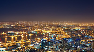 Buy stock photo Landscape of night city lights in Cape Town, South Africa with copy space. Night cityscape of a modern vacation or holiday destination. A bright and vibrant urban skyline at sunset 