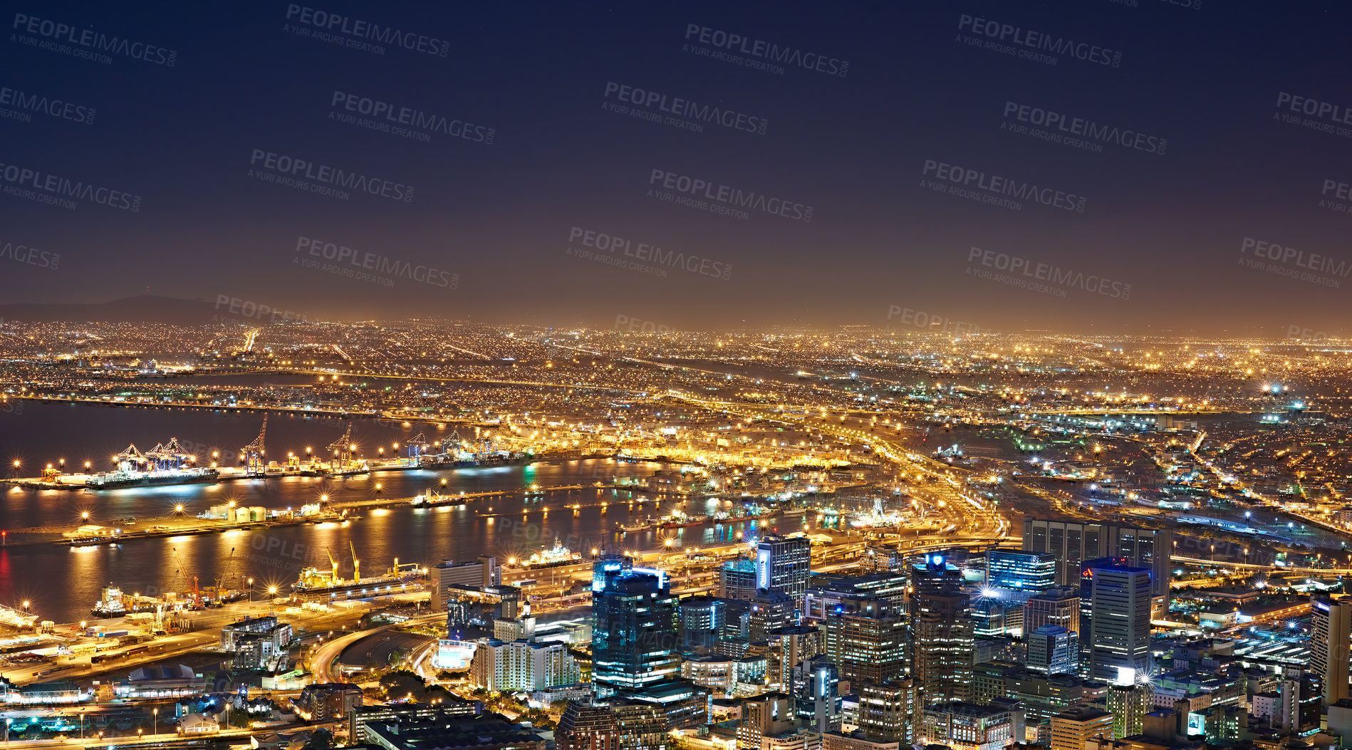 Buy stock photo Landscape of night city lights in Cape Town, South Africa with copy space. Night cityscape of a modern vacation or holiday destination. A bright and vibrant urban skyline at sunset 