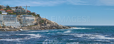 Buy stock photo Coastal view of Cape Town and mountain landscape on a sunny day. View of the ocean and city against a blue horizon. A popular travel destination for tourists and hikers, in Lion's Head, South Africa