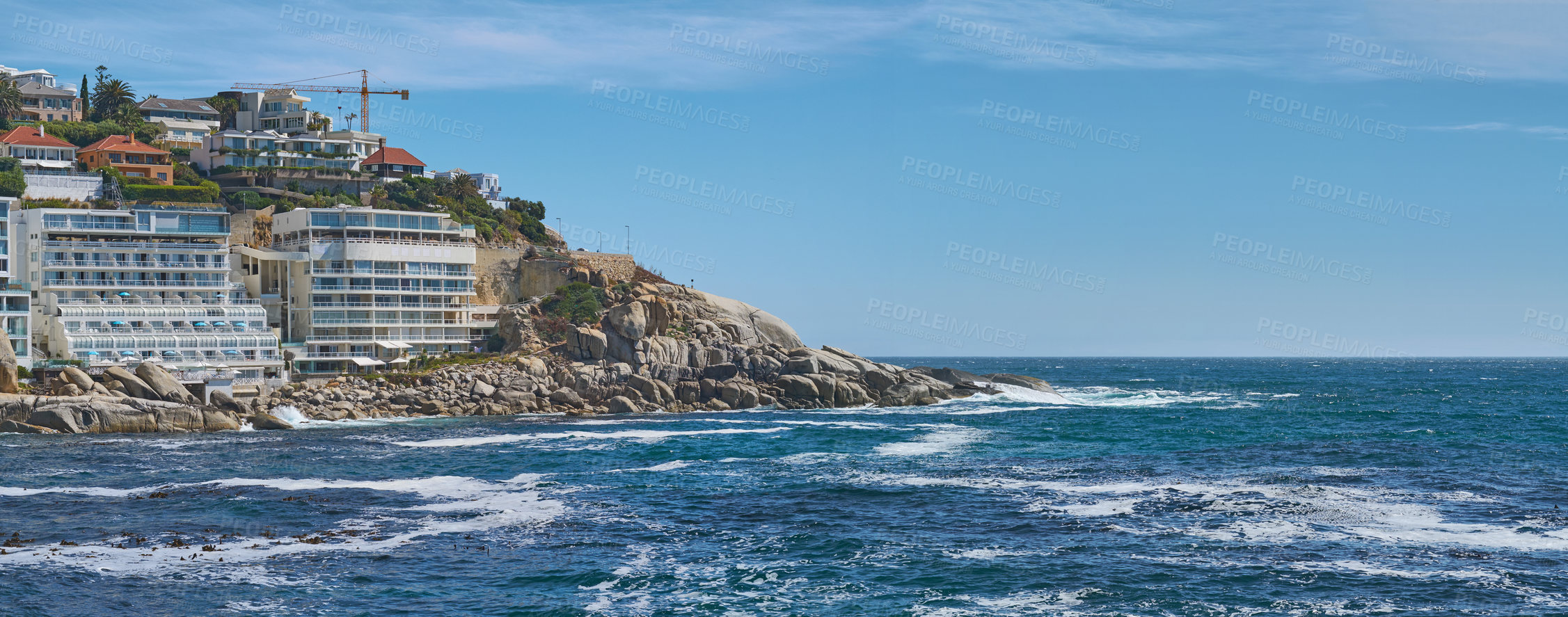 Buy stock photo Coastal view of Cape Town and mountain landscape on a sunny day. View of the ocean and city against a blue horizon. A popular travel destination for tourists and hikers, in Lion's Head, South Africa