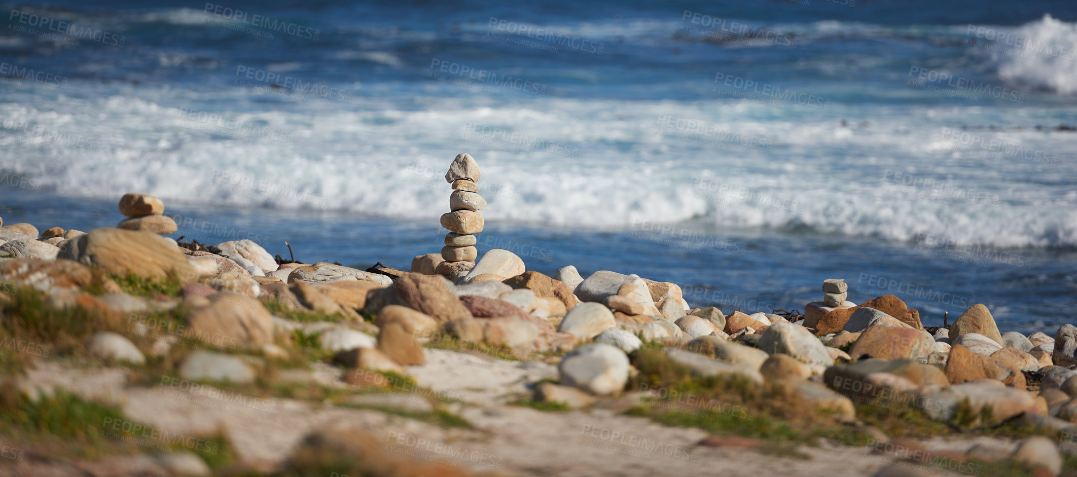 Buy stock photo Rocky coast of Cape Town in the Western Cape, South Africa. Rocks are used as a boundary on the seaside for protection from waves during high tide. Relaxing scenic view of the ocean and sea in summer