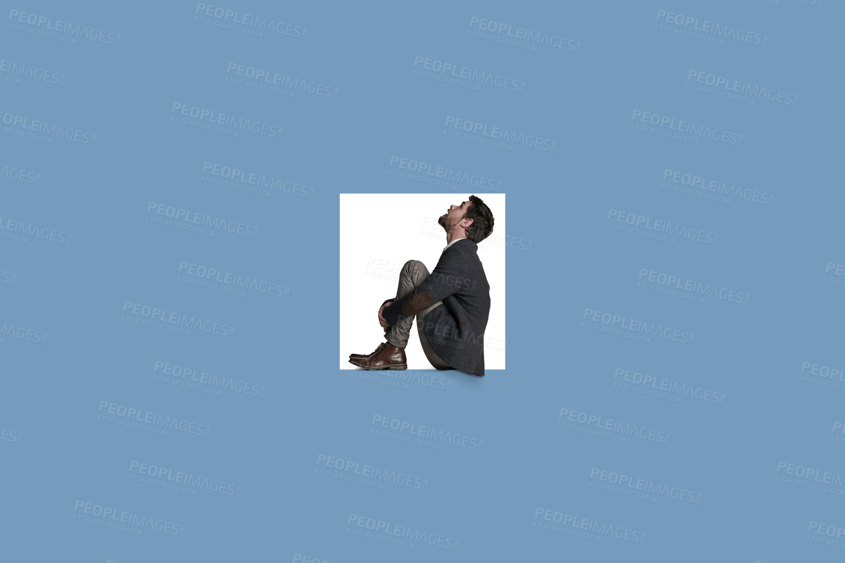 Buy stock photo Shot of a businessman trapped in a square against a blue background