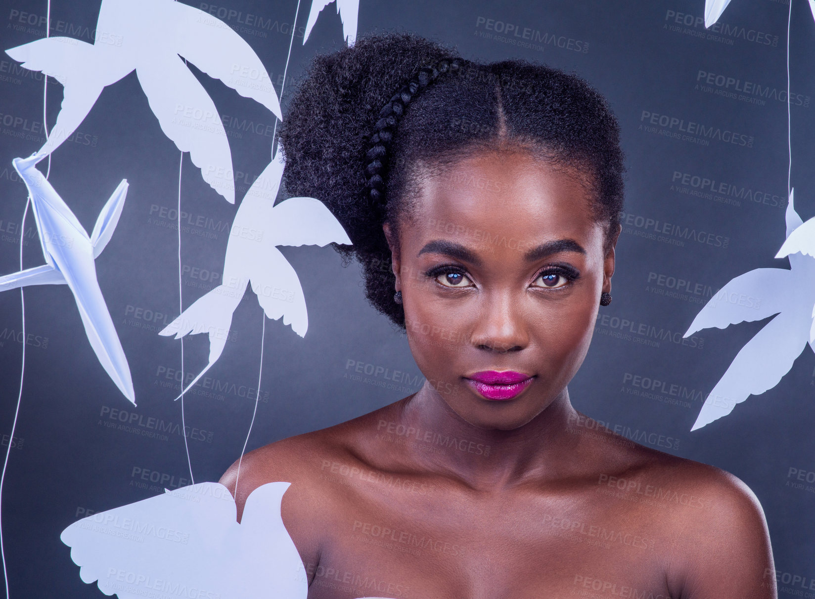 Buy stock photo Black woman, paper bird and portrait for beauty, peace and wellness isolated in dark background. African model, cosmetics and abstract fantasy with makeup, skincare and creative animal art or origami