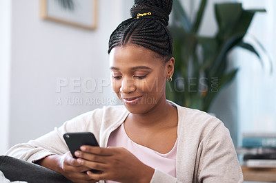 Buy stock photo Black woman, social media smartphone and living room sofa relax, typing and online connection, reading notification and iot website. Young african female, mobile app and internet tech on 5g home wifi