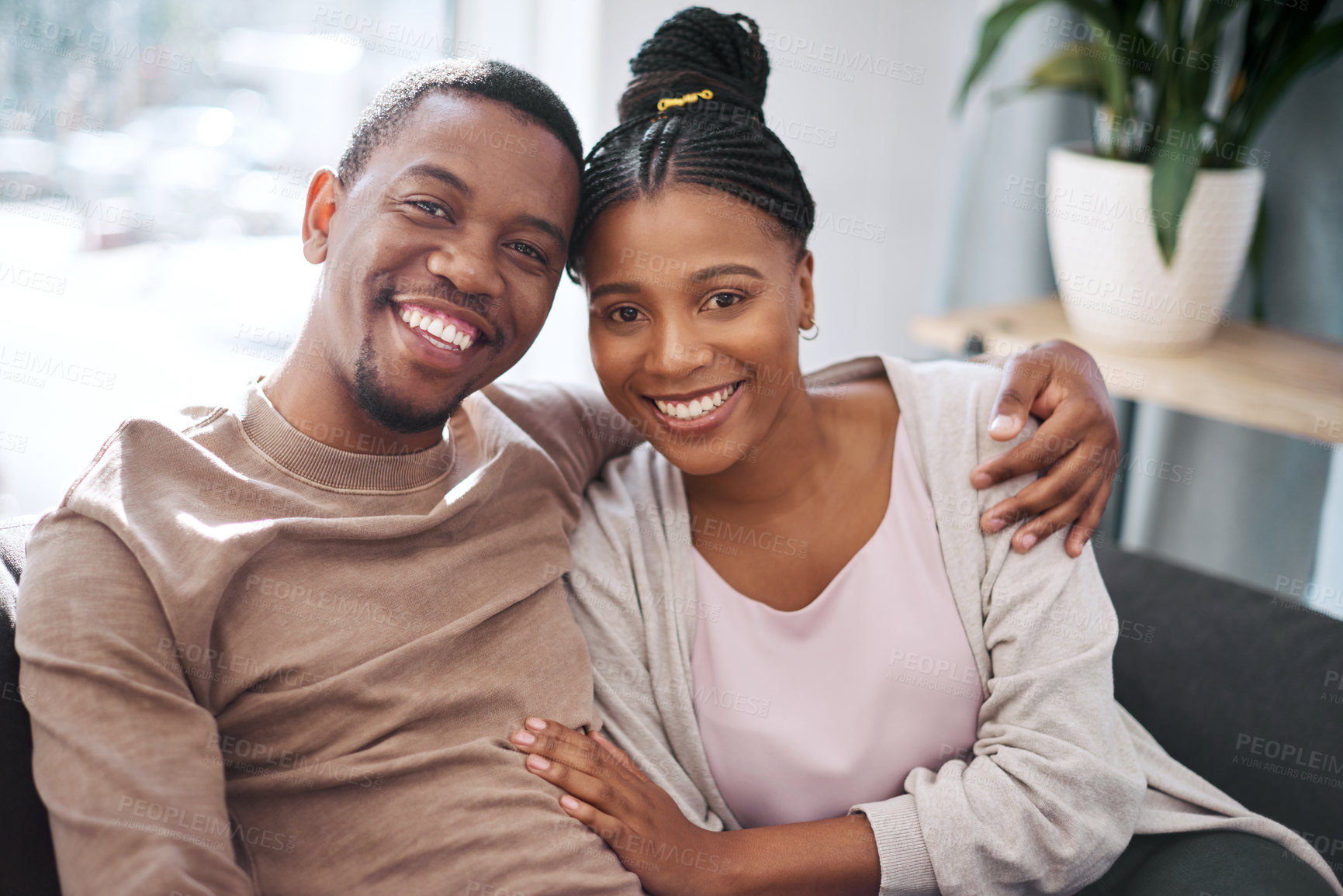 Buy stock photo Portrait, love and smile with a black couple in the living room of their home together to relax. Face, happy and affection with a man and woman bonding in their house on the weekend for romance