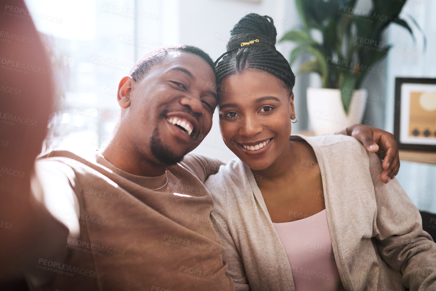 Buy stock photo Portrait, black couple and selfie in living room, happy and relax while bonding, embrace and smile in their home. Face, love and man with woman in lounge for photo, enjoy their relationship