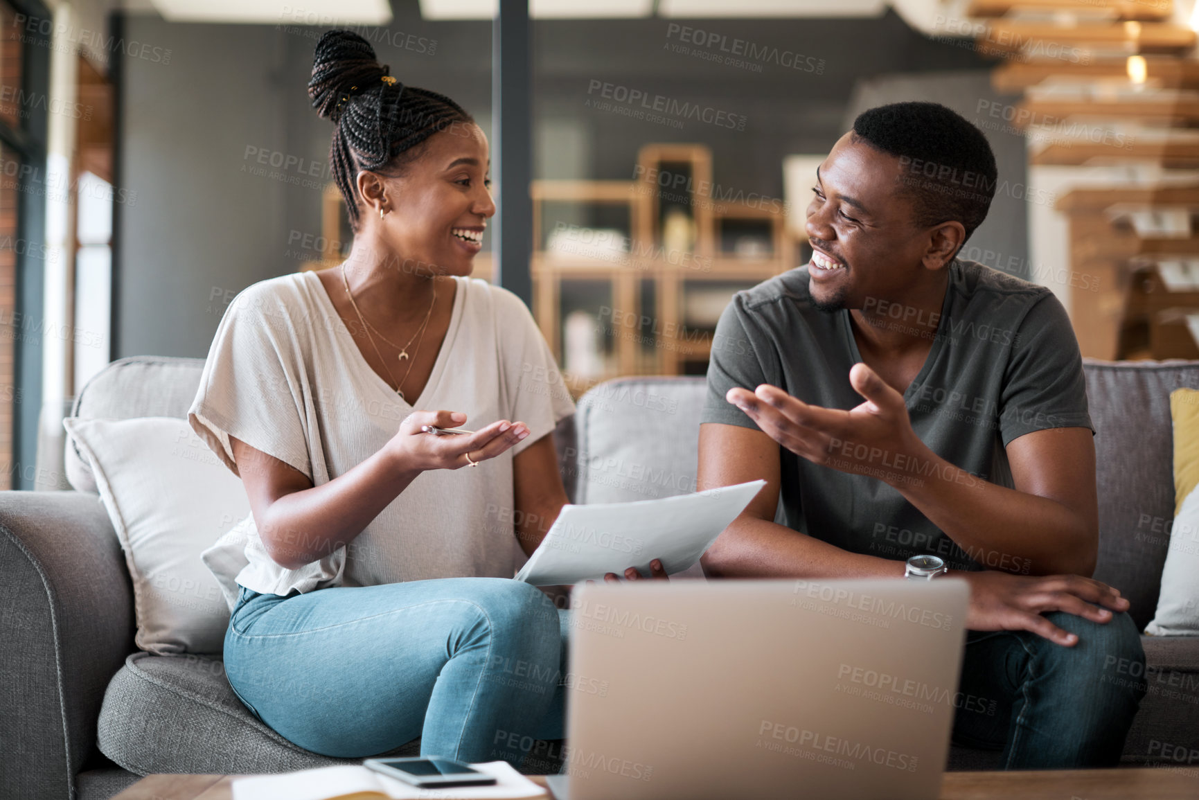 Buy stock photo Black couple, tax paperwork and bills together on sofa of living room at home with laptop, financial documents and planning savings. Family finances, organizing budget and paying debt online with pc