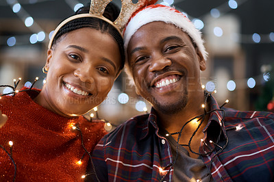 Buy stock photo Christmas, love and portrait of a happy black couple at a festive party celebration with lights. Happiness, smile and African man and woman at xmas holidays event together with traditional decoration