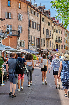 Buy stock photo Annecy, France, July, 17, 2019: Houses and street life in the famous medieval part of the city of Annecy, Department of Upper Savoy, France.