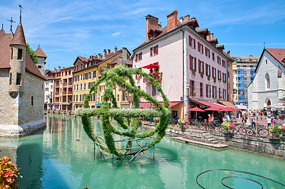 Buy stock photo Annecy, France, July, 17, 2019: Houses and street life in the famous medieval part of the city of Annecy, Department of Upper Savoy, France.