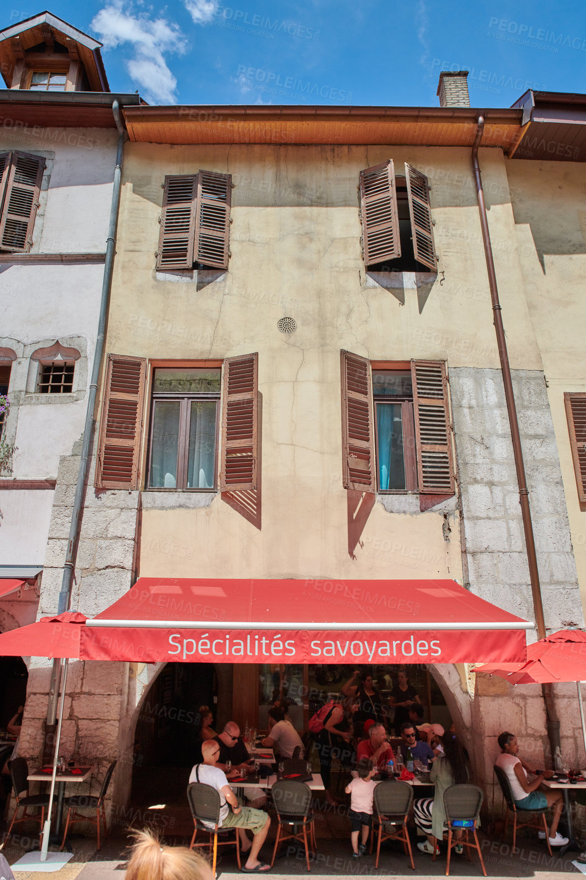 Buy stock photo Annecy, France, July, 17, 2019: Houses and street life in the famous medieval part of the city of Annecy, Department of Upper Savoy, France.