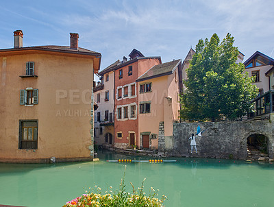 Buy stock photo Annecy, France, July, 17, 2019: Houses and street life in the famous medieval part of the city of Annecy, Department of Upper Savoy, France.