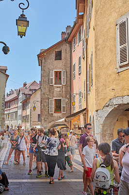 Buy stock photo Annecy, France, July, 17, 2019: Houses and street life in the famous medieval part of the city of Annecy, Department of Upper Savoy, France.