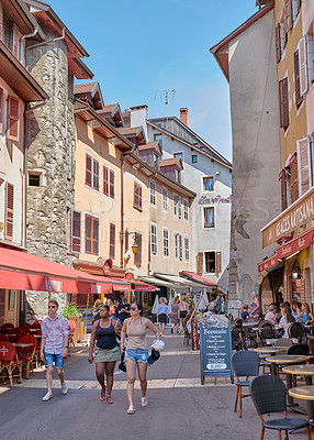 Buy stock photo Annecy, France, July, 17, 2019: Houses and street life in the famous medieval part of the city of Annecy, Department of Upper Savoy, France.