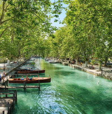 Buy stock photo Annecy, France, July, 17, 2019: Houses and street life in the famous medieval part of the city of Annecy, Department of Upper Savoy, France.