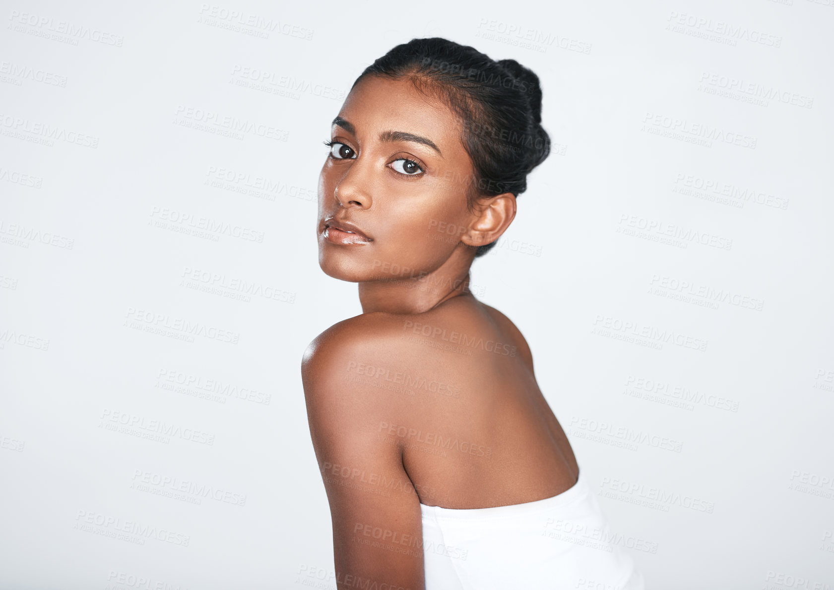 Buy stock photo Portrait, woman and skincare in studio for dermatology treatment, body care and beauty on white background. Indian model, confident and natural glow for aesthetic, wellness or healthy shine and salon