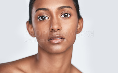 Buy stock photo Shot of a beautiful young woman posing against a white background