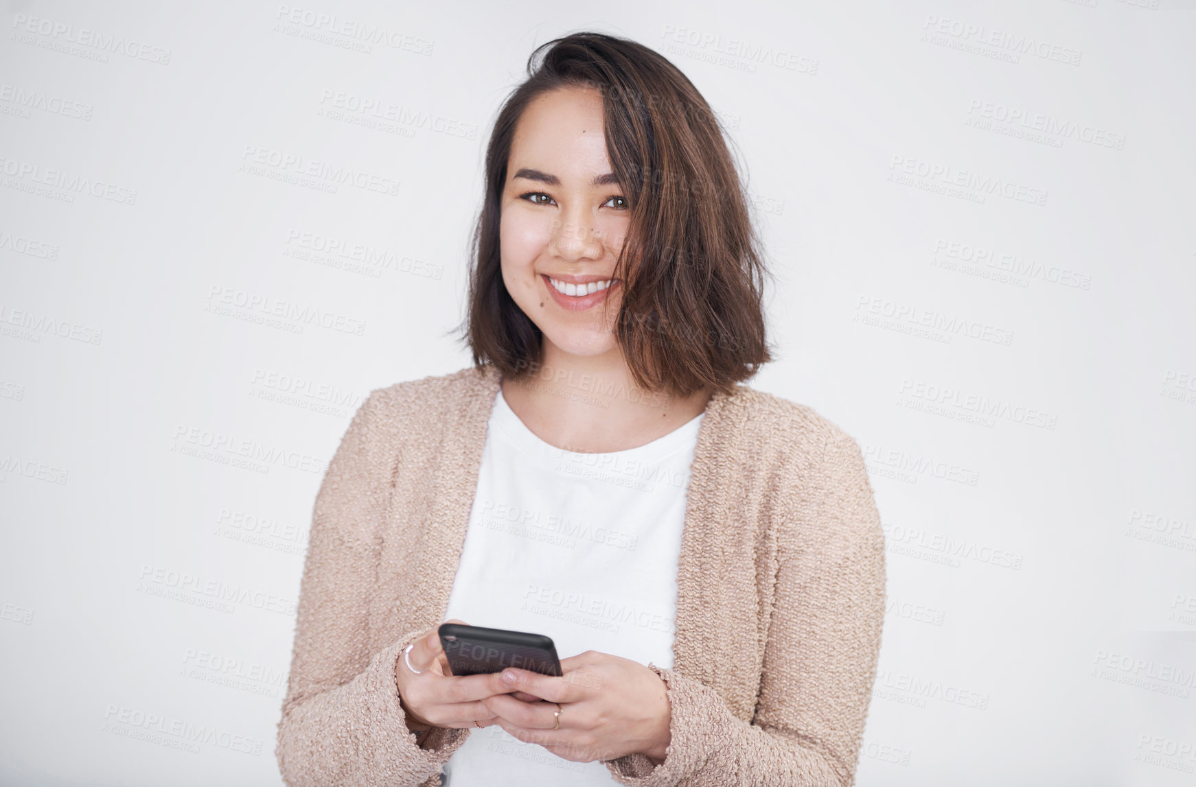 Buy stock photo Portrait, smile and woman with smartphone, typing and mobile user on white studio background. Face, person and model with cellphone, communication or network with social media, message or digital app