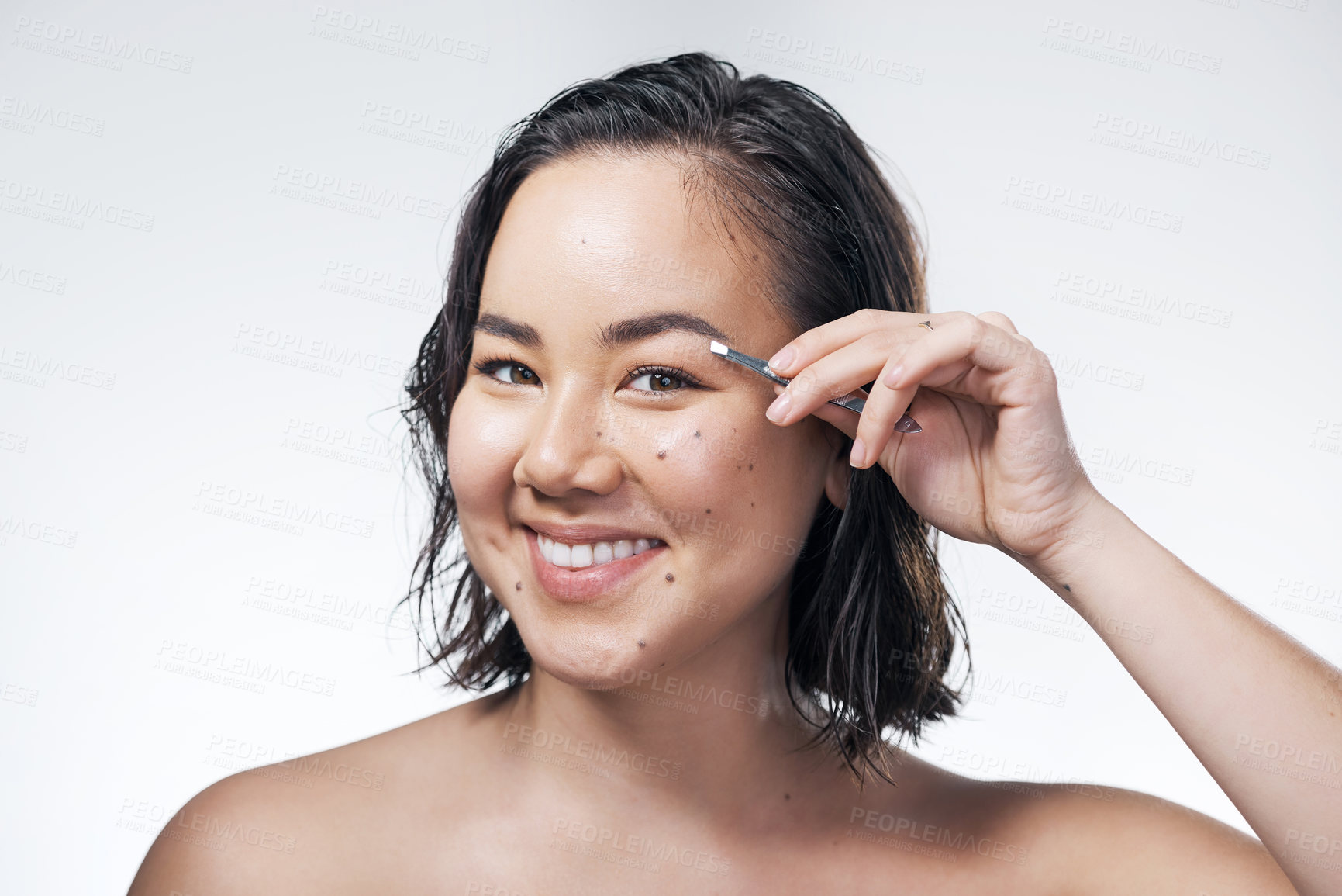 Buy stock photo Happy, portrait and asian woman with tweezer for eyebrows, hair removal or beauty on a white studio background. Young beautician, female person or gen z model with pincers for brow shape or grooming