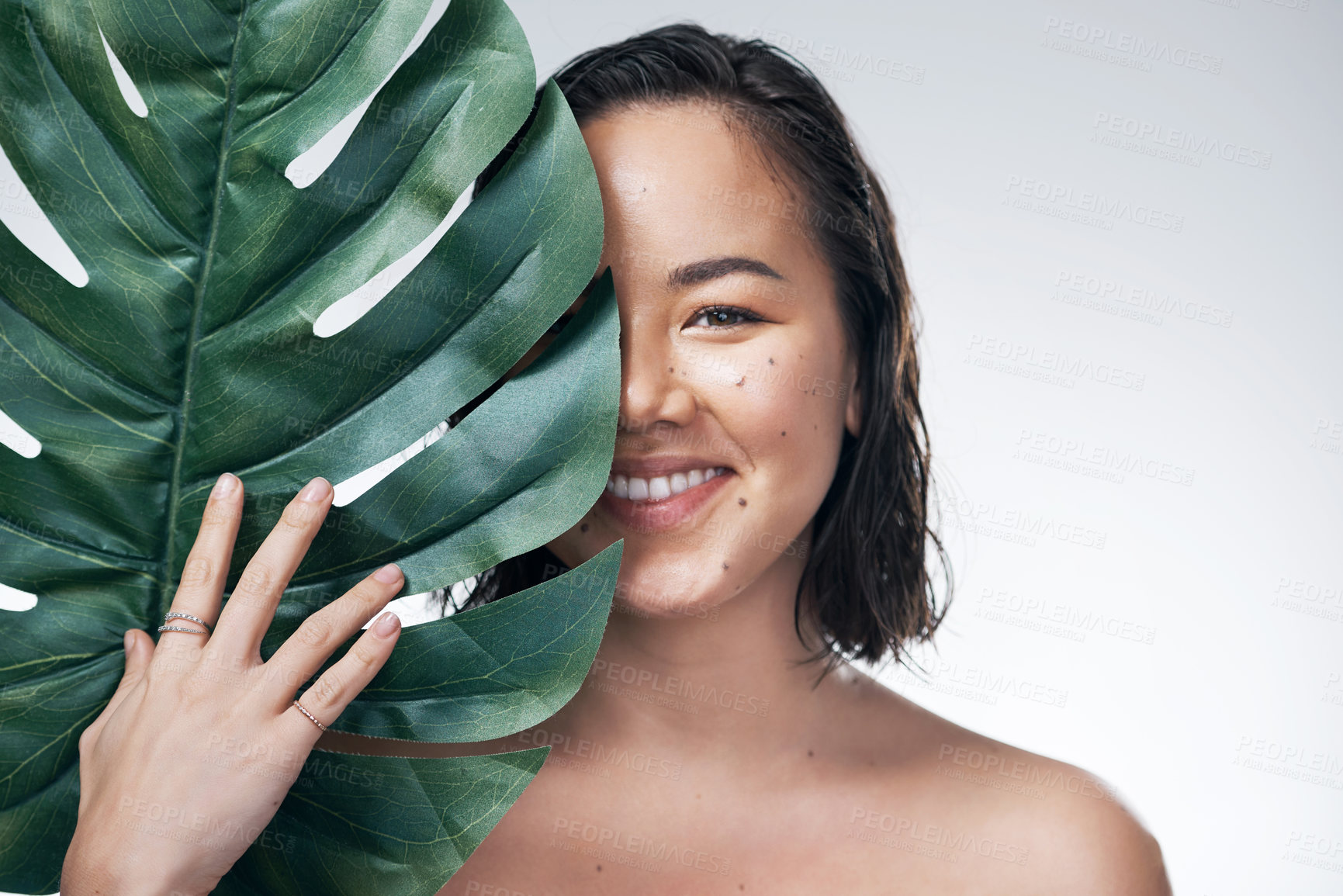 Buy stock photo Woman, portrait and natural beauty with monstera leaf, sustainable skincare on white background. Wellness, skin glow and eco friendly cosmetics, green and product from nature with aesthetic in studio