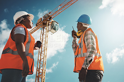 Buy stock photo Walkie talkie, crane and engineering team at construction site for building project and teamwork. Black woman and man manager together for engineer communication or safety inspection outdoor