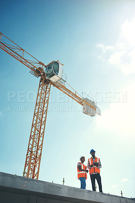 Buy stock photo Building roof, tablet and engineer team talking about construction vision, development or architecture. Black woman and man outdoor for engineering, innovation or safety discussion with sky mockup