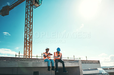 Buy stock photo Engineer, team and talking on building roof at construction site about break time, development or architecture. Black woman and man outdoor for engineering project, teamwork or safety with sky mockup