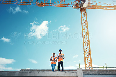 Buy stock photo Building roof, engineer team talking at construction site outdoor for vision, development or architecture. Black woman and man for engineering teamwork, planning or safety discussion with sky mockup