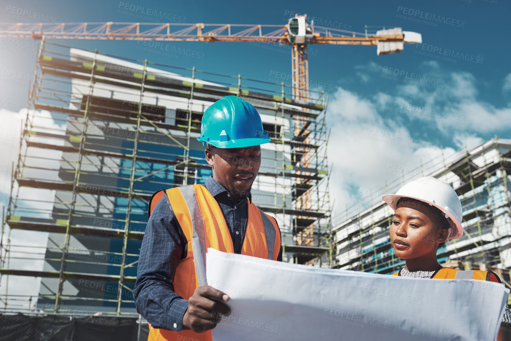 Buy stock photo Construction, engineer or architect team with blueprint for building project, collaboration and architecture. Black woman and man together for engineering, planning and safety discussion outdoor