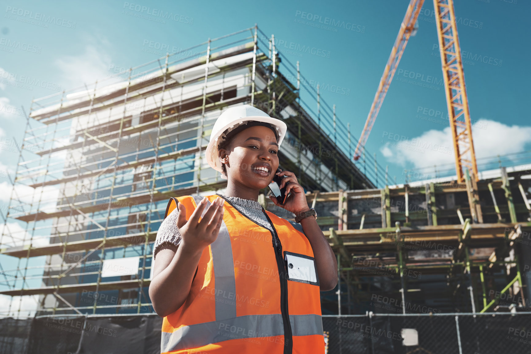 Buy stock photo Black woman, engineer talking and outdoor with phone call, contact and inspector for property plan. Low angle, construction and contractor speaking to client, communication app and urban project