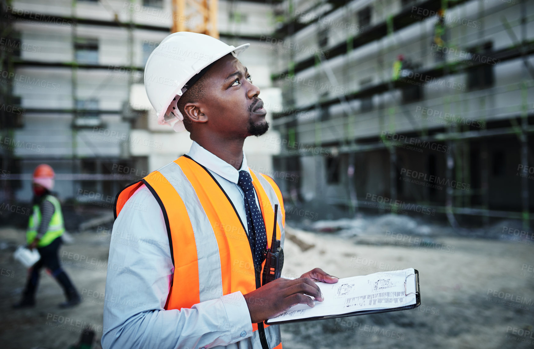 Buy stock photo Black man, civil engineer and inspector with clipboard for construction planning or site layout in city. African, male person thinking or architect with architecture checklist or industrial project