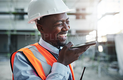 Buy stock photo Shot of a young man using a smartphone while working at a construction site