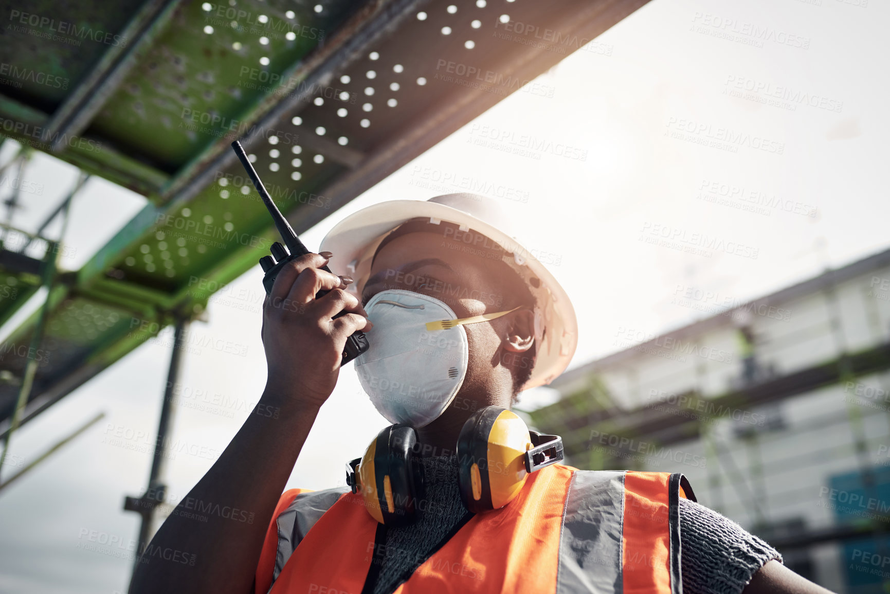 Buy stock photo Black woman, radio and construction for engineering, communication and site assessment with helmet. Architect, inspection and contractor for project management, building development and renovation