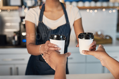 Buy stock photo Closeup shot of a barista serving coffee to a customer in a cafe