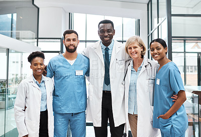 Buy stock photo Portrait of a group of medical practitioners standing together in a hospital