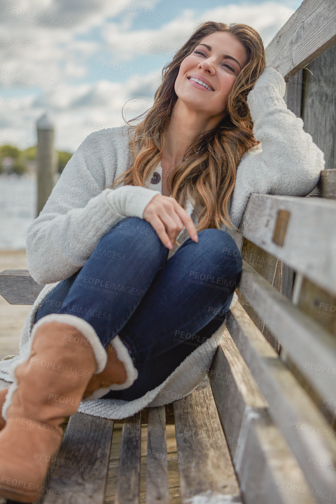 Buy stock photo Smile, woman and relax with bench outdoor for vision, calm morning and scenery on holiday. Thinking, female person and tourist daydreaming on stool with reflection, sightseeing view and vacation trip