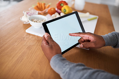 Buy stock photo Hands, person and tablet screen for cooking at house with vegetables, recipe research and learning tutorial. Chef, online and ingredients of meal prep, reading website and nutrition tips of diet menu