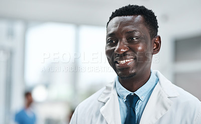 Buy stock photo Shot of a mature doctor standing in a hospital