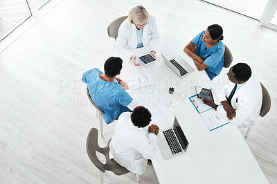 Buy stock photo High angle shot of a group of medical practitioners having a meeting in a hospital boardroom