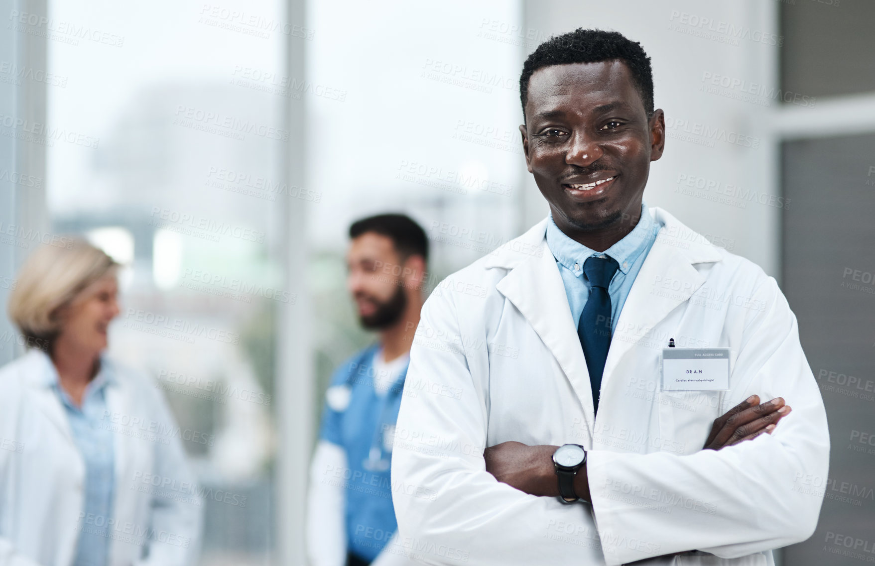 Buy stock photo Portrait of a mature doctor standing in a hospital